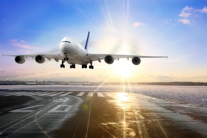 Passenger airplane landing on runway in airport.