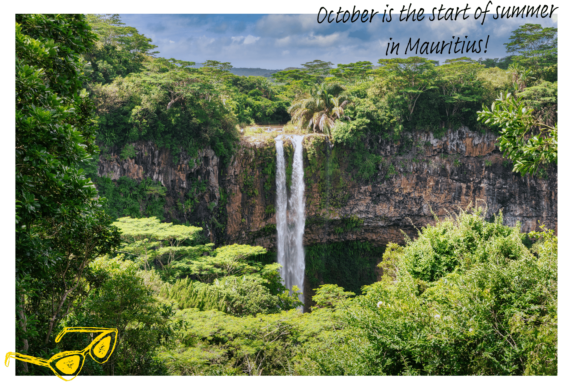 Where's hot in October? A waterfall in Mauritius, surrounded by lush greenery.