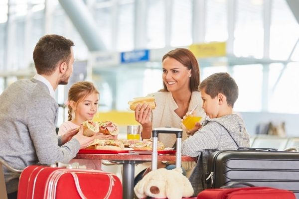 family eating at airport