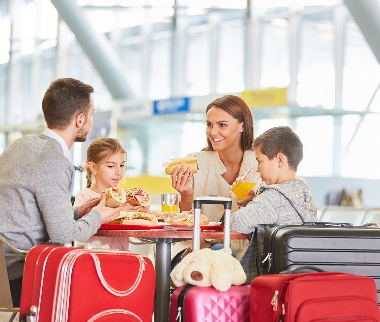 family eating at airport