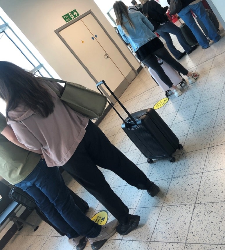 social distancing airport queue