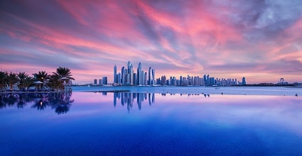 Dubai sunset with skyline reflection in water