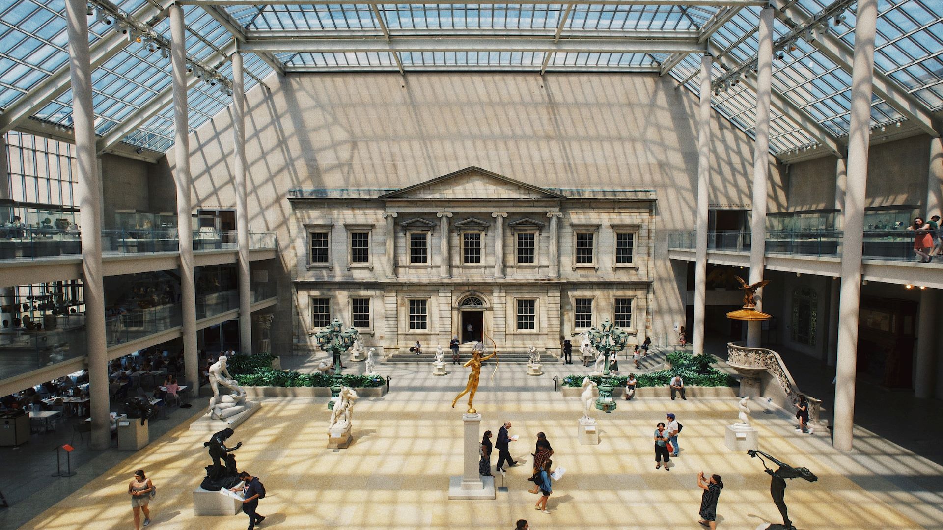 Visitors admire the exhibits on display in one of the rooms at the Metropolitan Museum of Art.