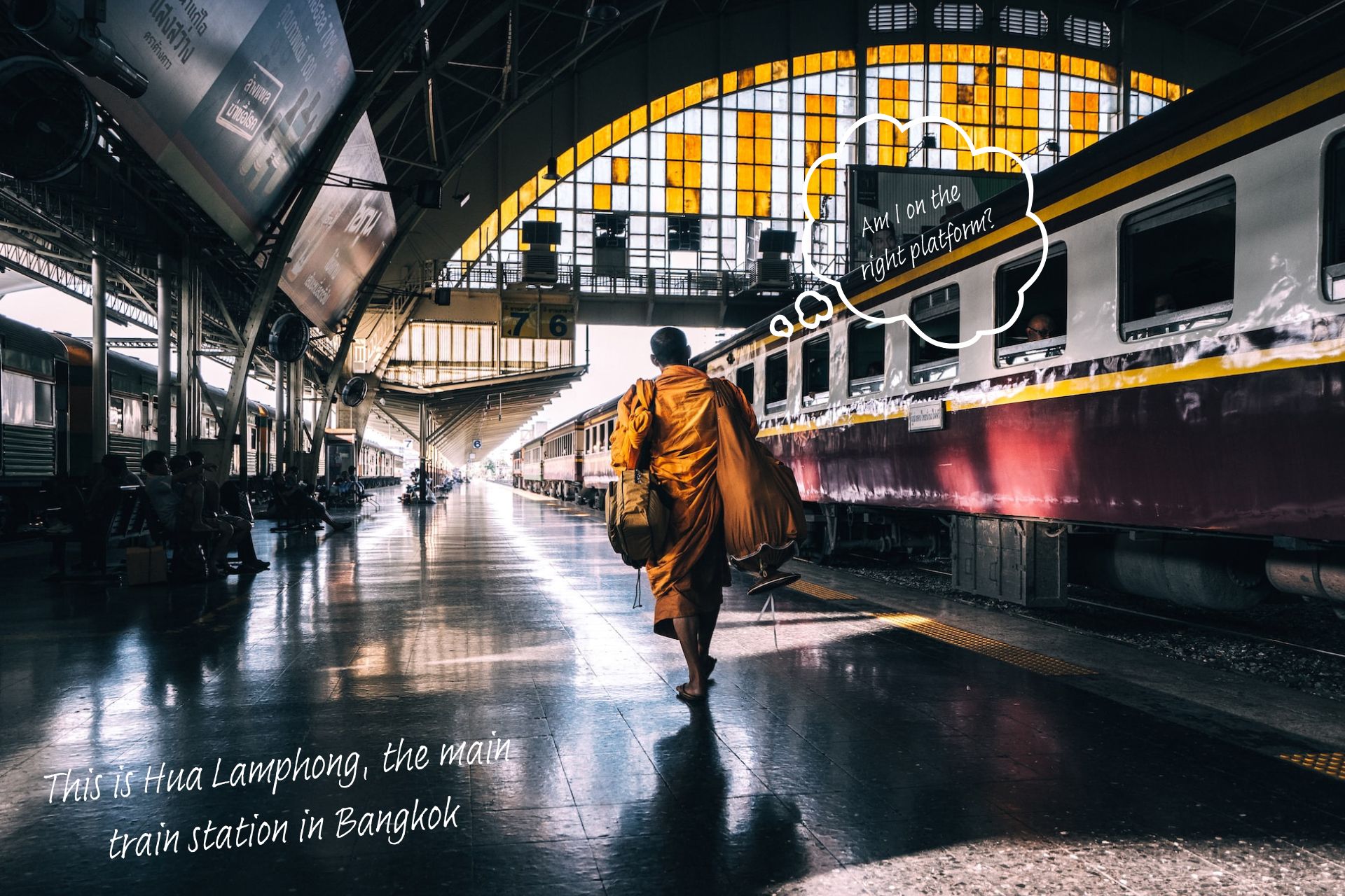 Hua Lamphong train station in Bangkok. A thought bubble rises above a monk's head and says, "Am I on the right platform?"