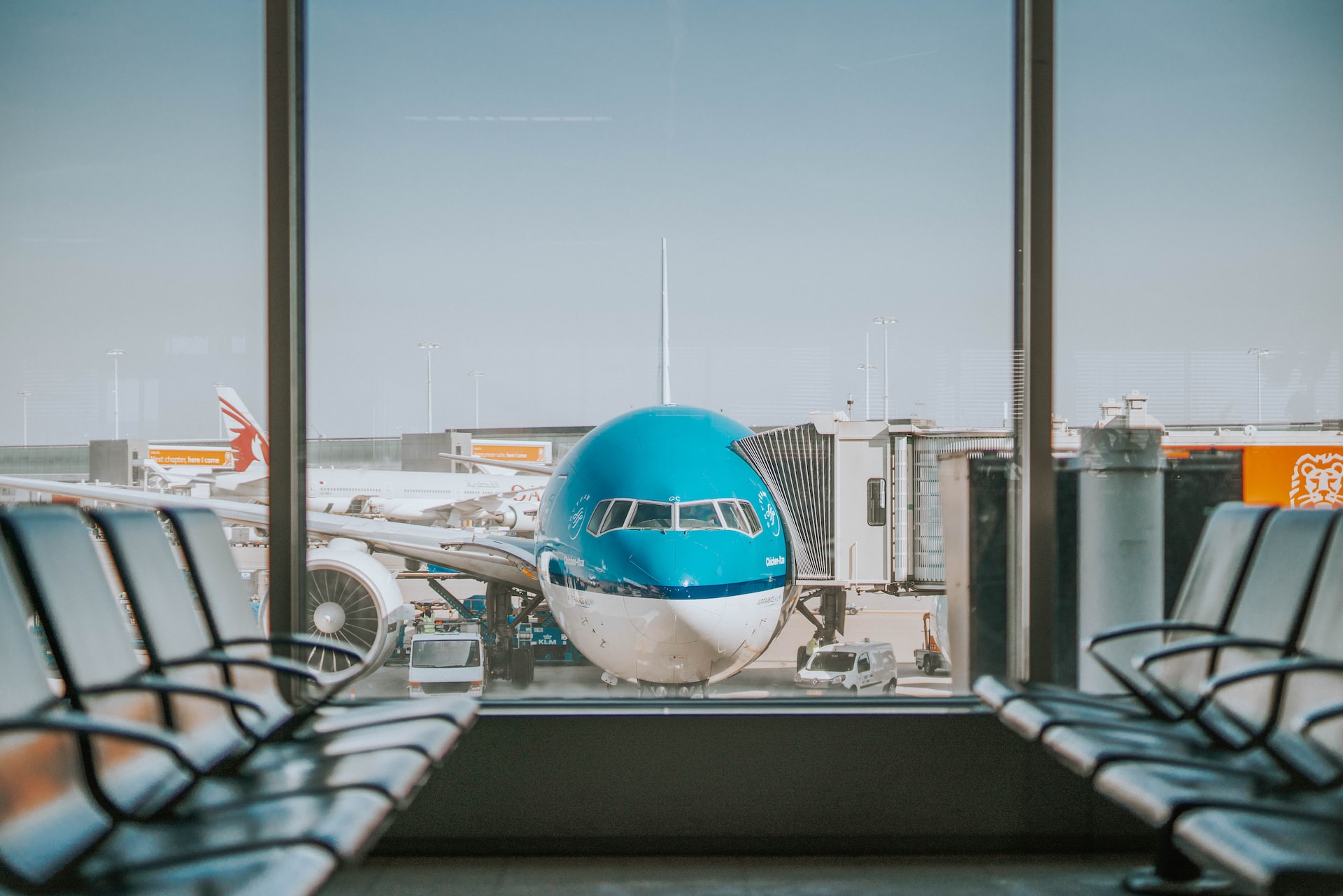 A plane sits outside an airport terminal.