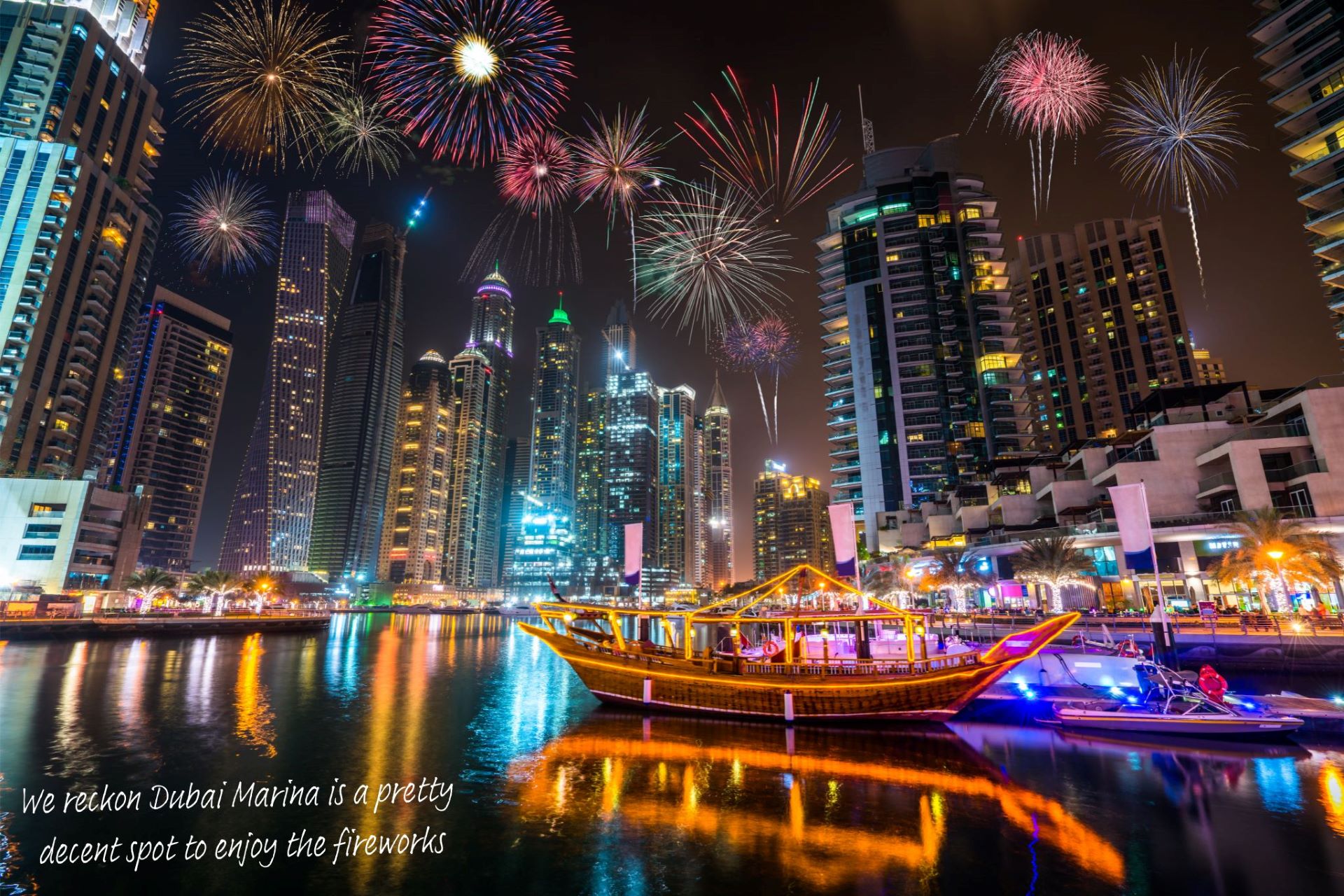 Fireworks explode above Dubai Marina.