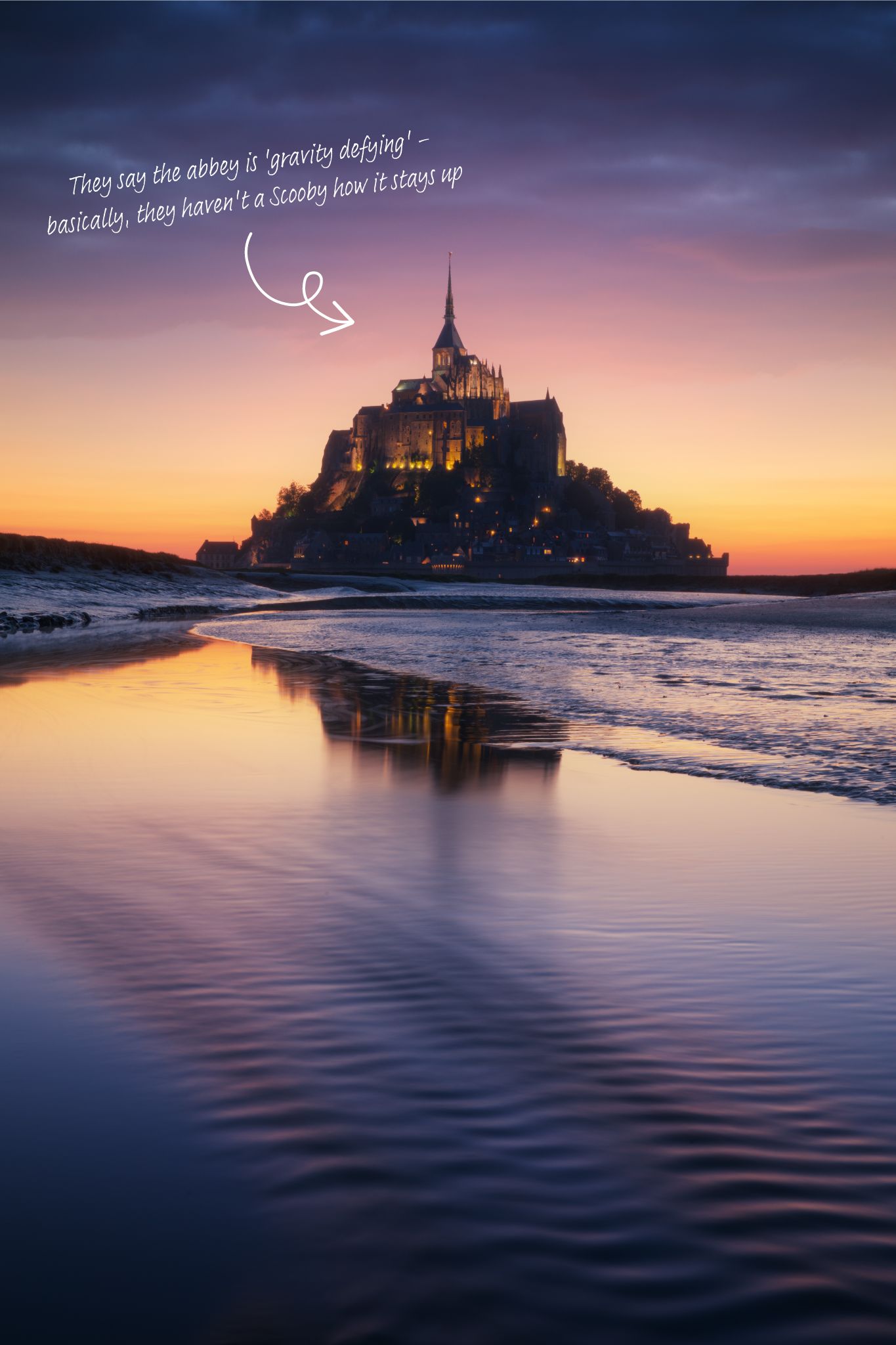 Mont Saint Michel at sunset and low tide.