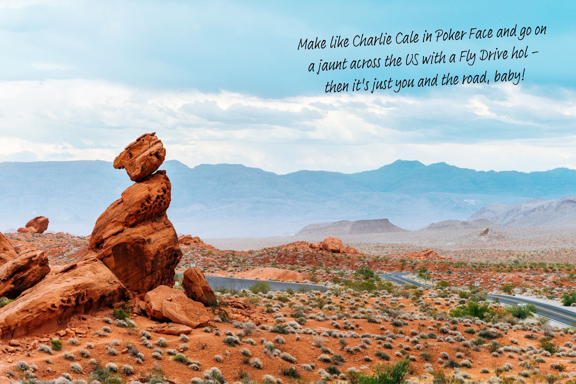 A rock formation stands in the foreground of the orange/red, dusty stretches of the Nevada desert outside Las Vegas, mountains in the far distance.