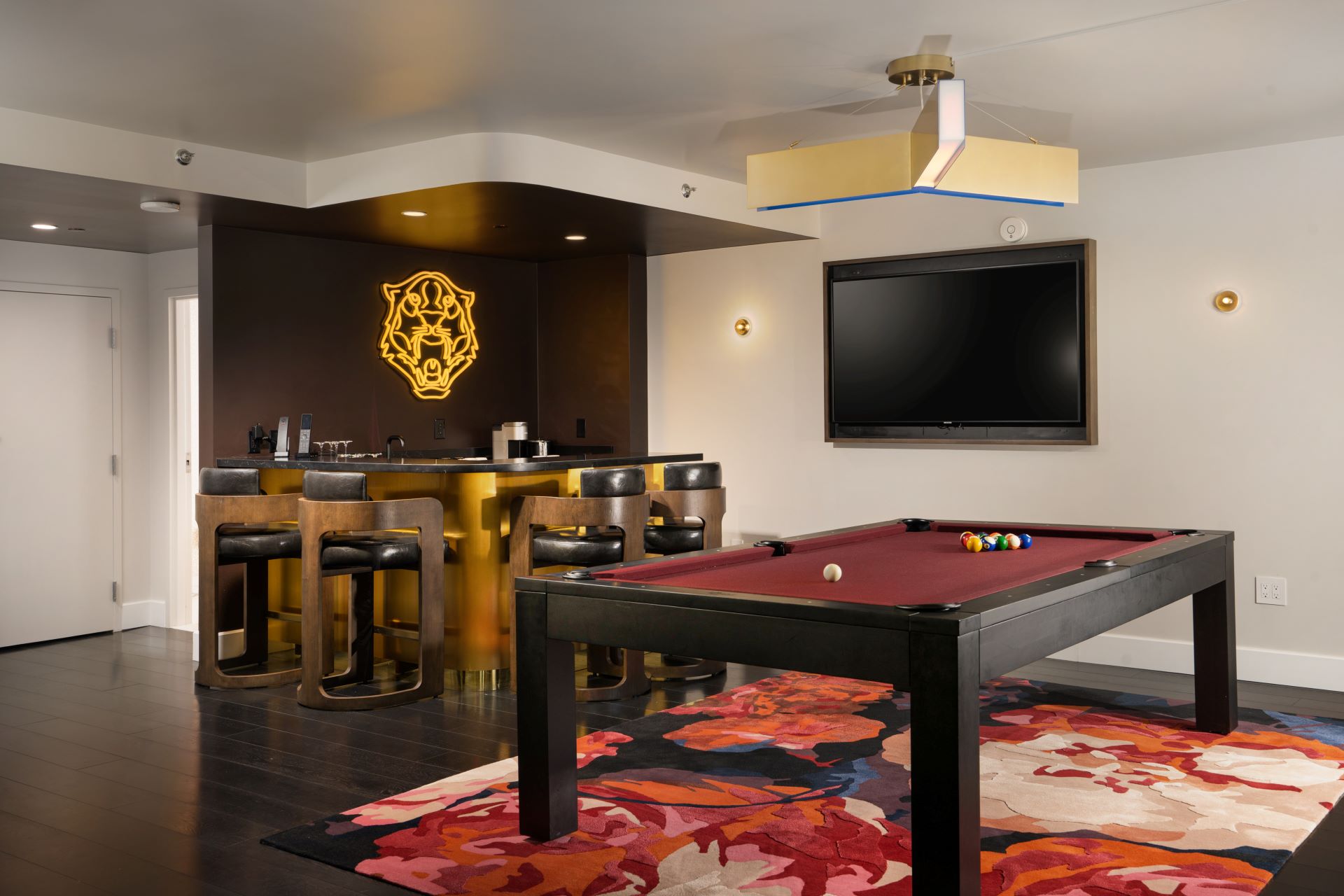 The billiards room in the Shag Suite, with a billiards table in the centre of the room, and a bar in the corner.
