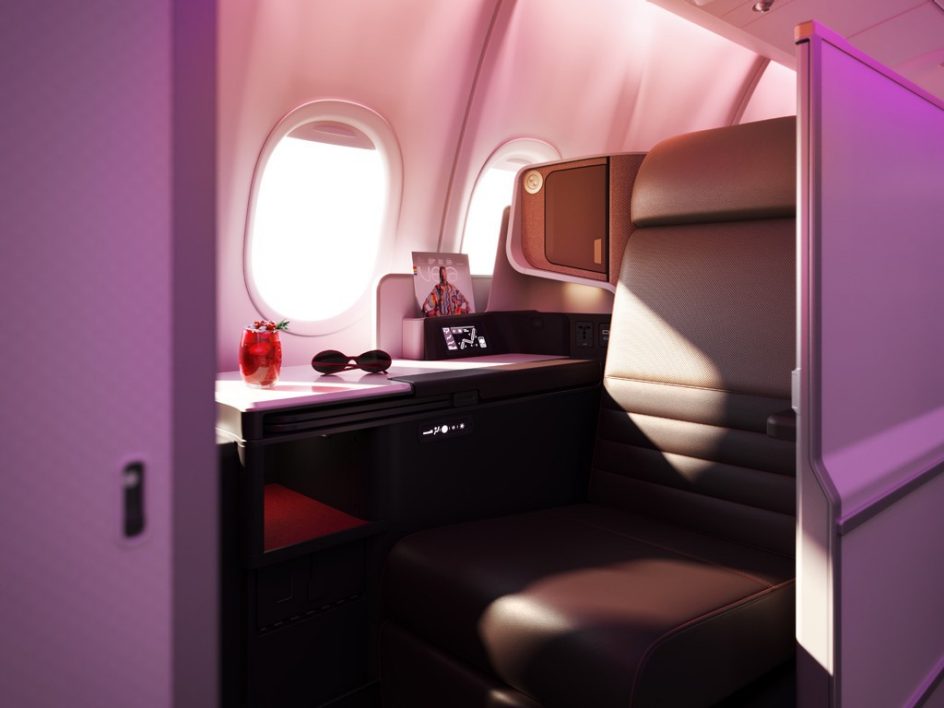 The Upperclass seats on the A330neo. A leather seat with a large side table and window, sunlight streaming in.