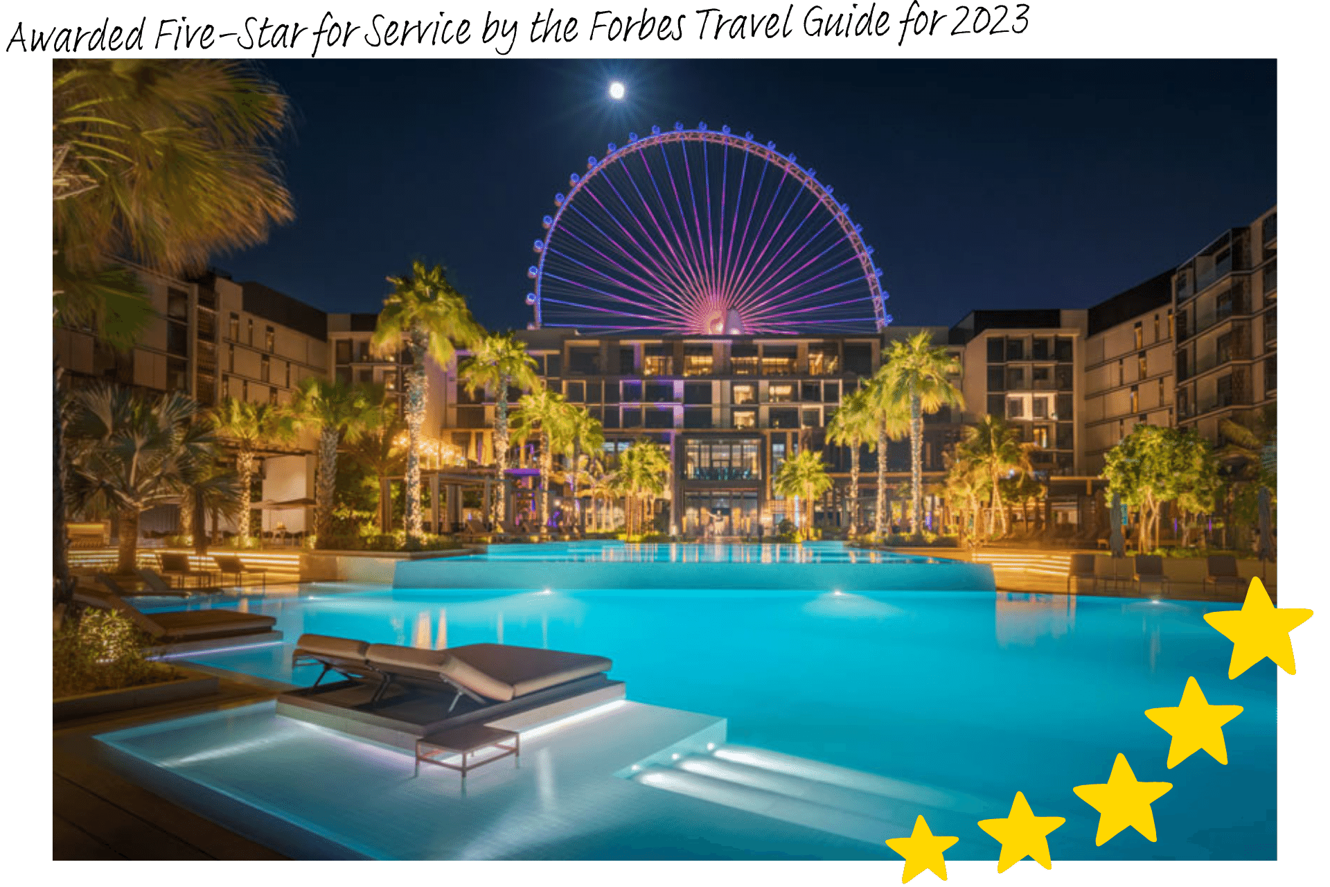 Caesars Palace is a luxury hotel on Dubai's Bluewaters Island: an image of the outdoor pool at night, the Ain Dubai wheel looming over the building.