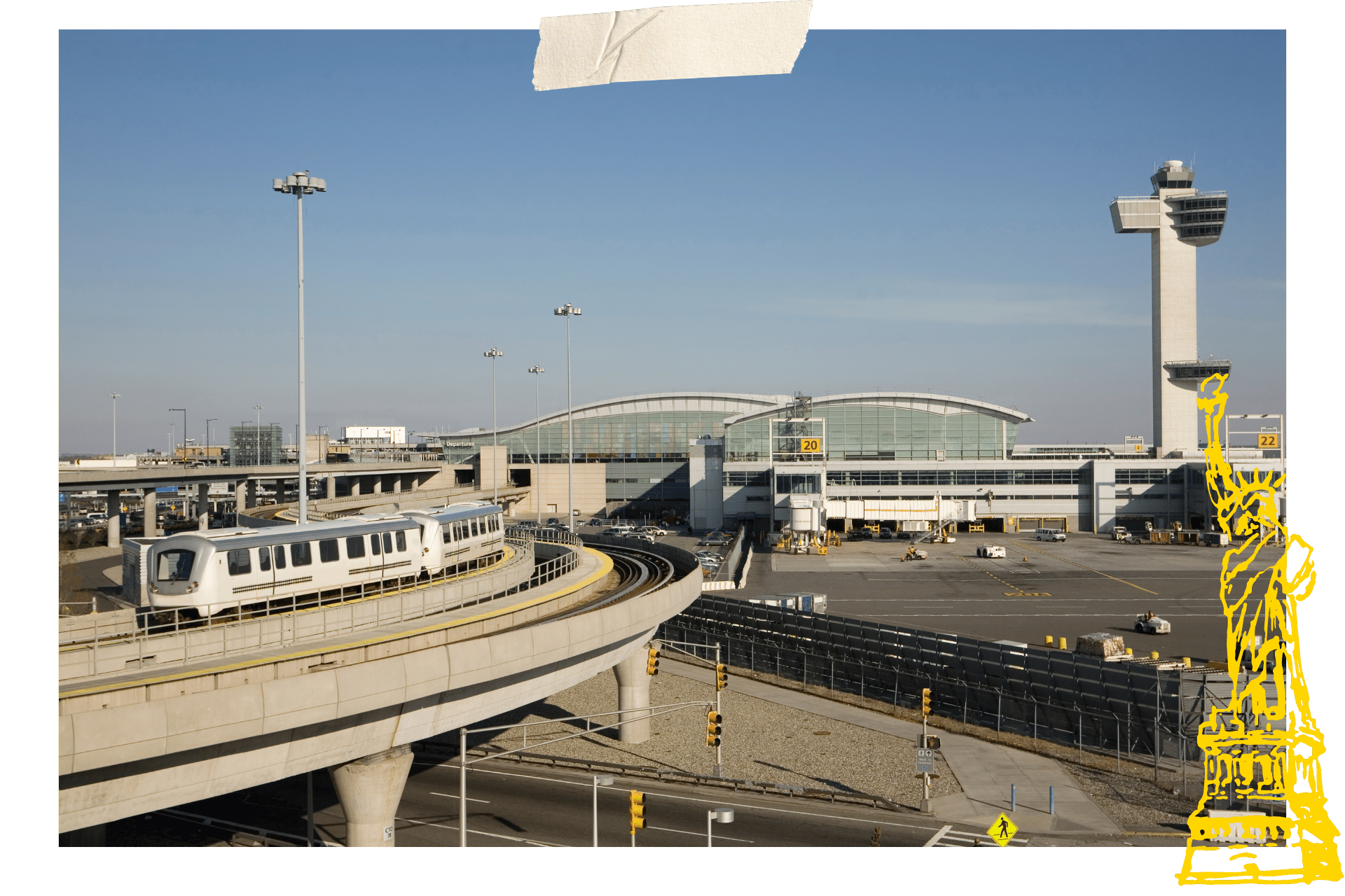 A picture of JFK International Airport, with a train headed away. If you're wondering how to get around New York for less money? Use public transport to get to and from the airport instead of a taxi.