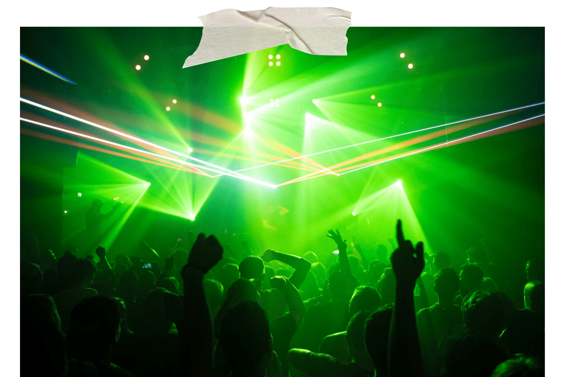 Image shows the interior of a night club, lit up by strobe lights and with hands in the air.